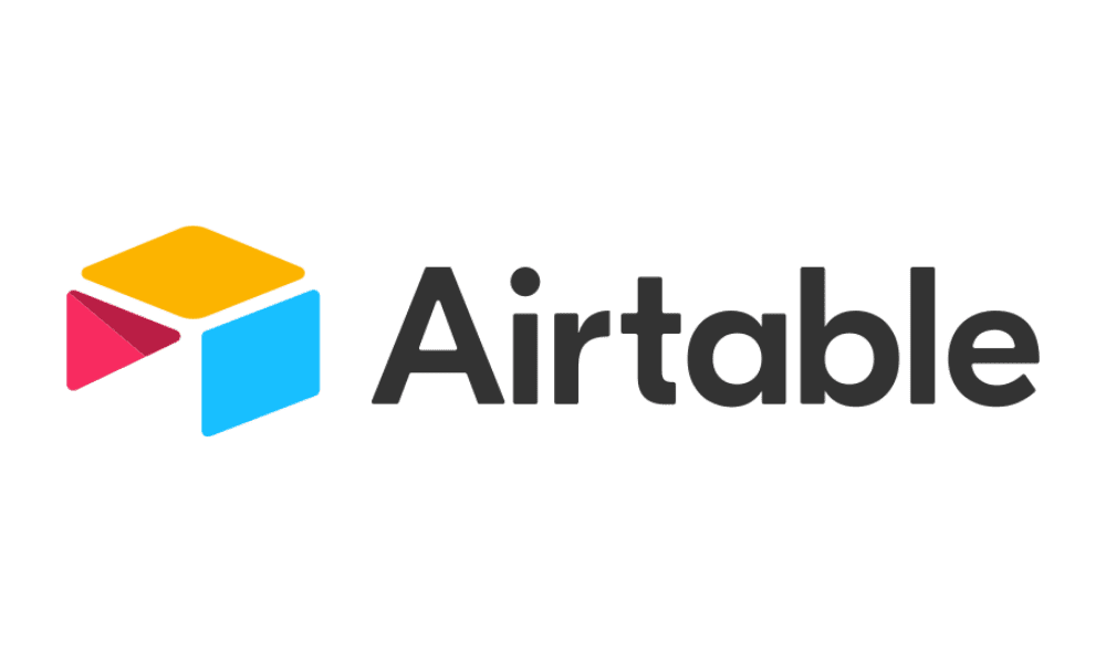 Logo of airtable featuring a stylized, colorful geometric icon composed of a yellow, pink, and blue shape next to the word "airtable" in black font.